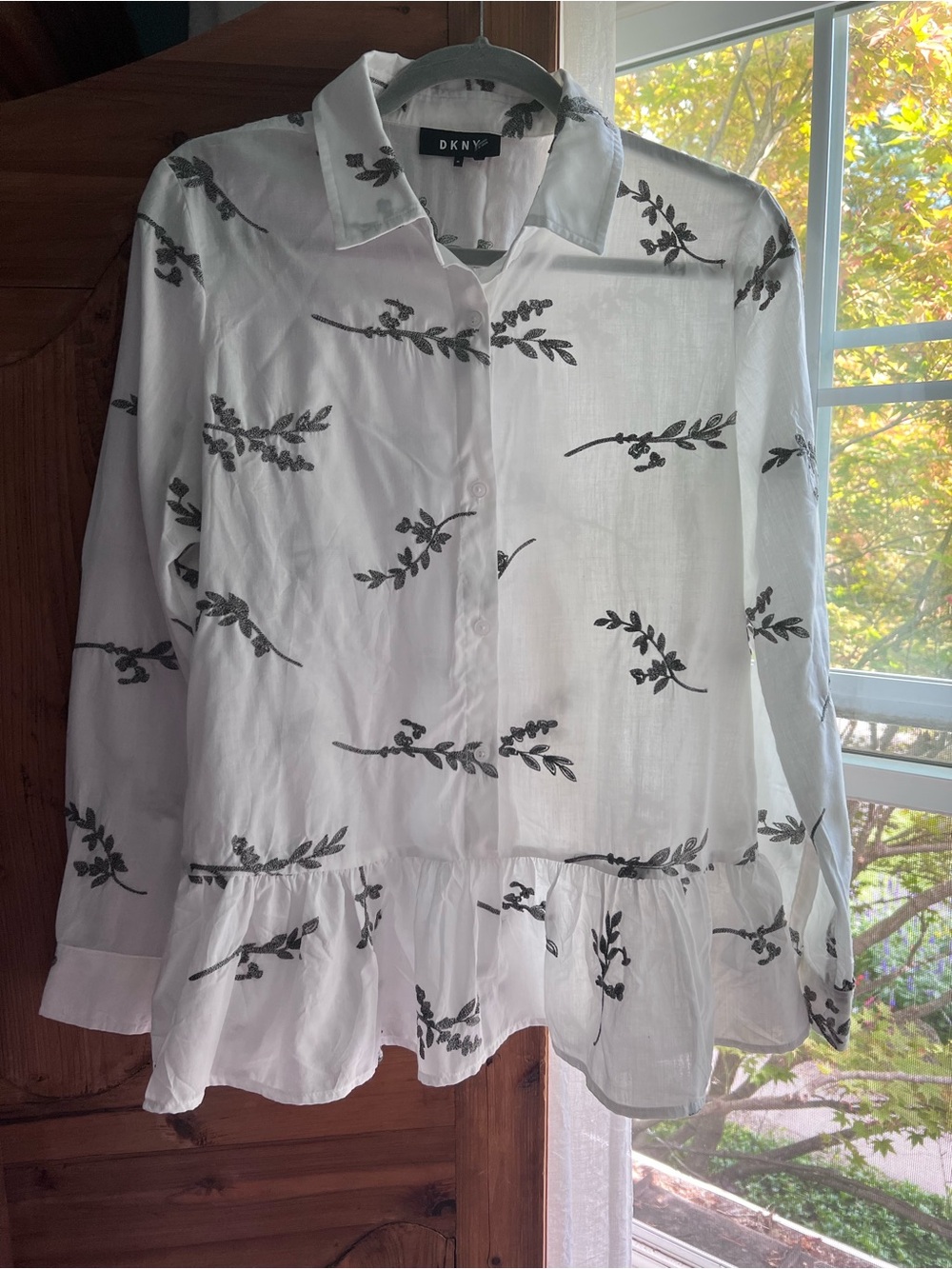 DKNY White Button-Up Blouse with Black Leaf Motif and Ruffle Hem